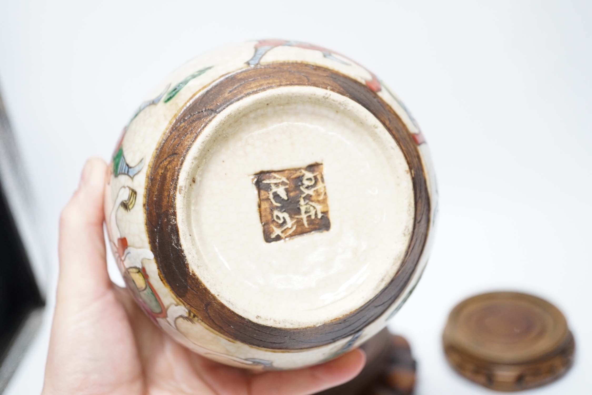 A Chinese famille verte vase, Kangxi period (cut down) and three Chinese polychrome jars with hardwood stands, tallest 19cm